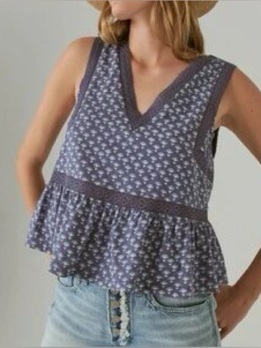 Lucky Brand tank top features a geometric blue pattern, a deep V-neck